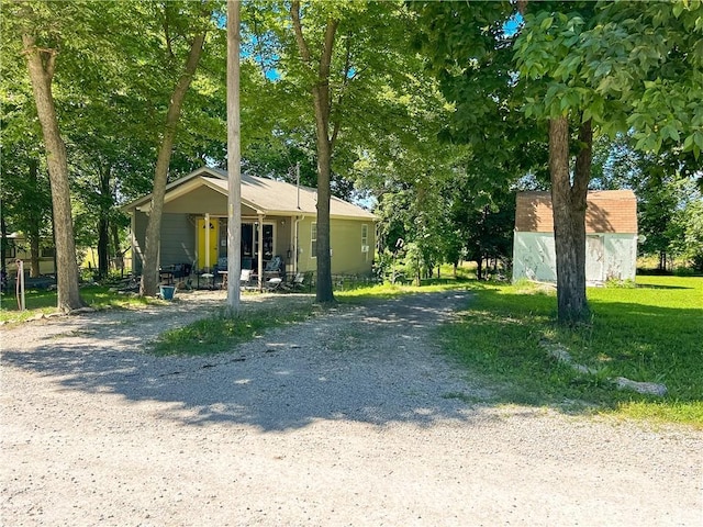 21 Oak Crest Dr, Linn Valley, KS 66040 - view of front of house with driveway and an outbuilding