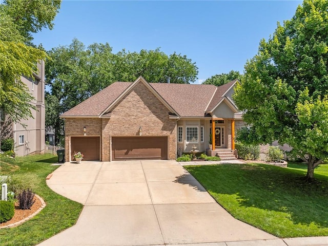 14740 W 128th St, Olathe, KS 66062 - view of front of house featuring brick siding, a front lawn, driveway, and a garage