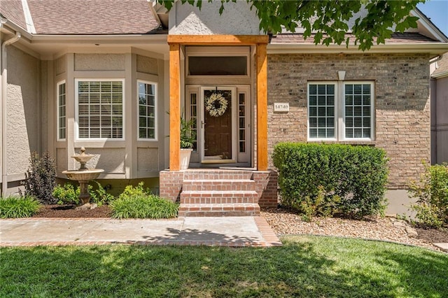 14740 W 128th St, Olathe, KS 66062 - doorway to property featuring roof with shingles