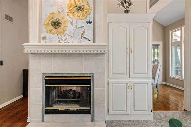14740 W 128th St, Olathe, KS 66062 - detailed view of a tiled fireplace and wood finished floors