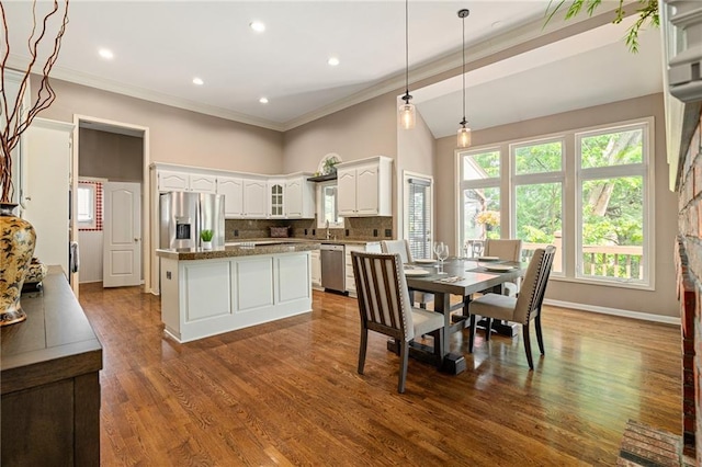 14740 W 128th St, Olathe, KS 66062 - dining area featuring crown molding, dark wood-style floors, and recessed lighting