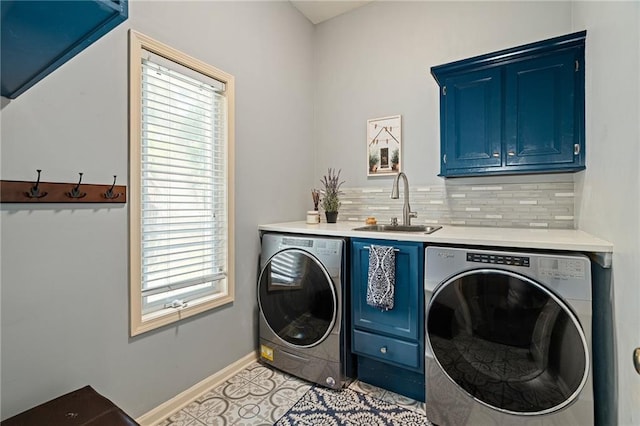 14740 W 128th St, Olathe, KS 66062 - laundry area featuring cabinet space, washing machine and clothes dryer, and light tile patterned floors