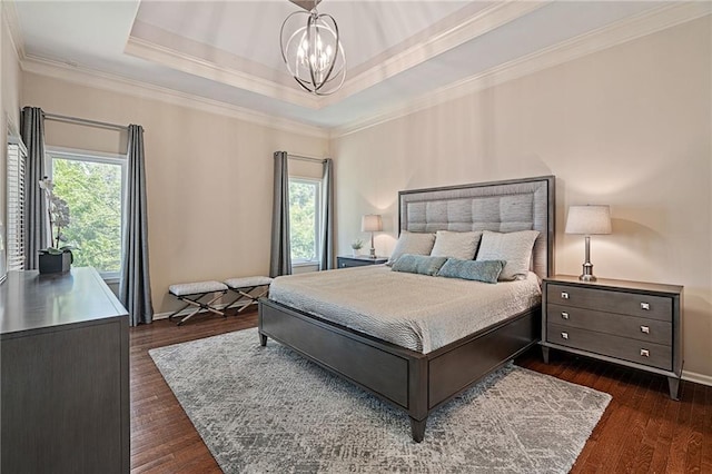14740 W 128th St, Olathe, KS 66062 - bedroom featuring dark wood-style floors, a chandelier, ornamental molding, and a raised ceiling