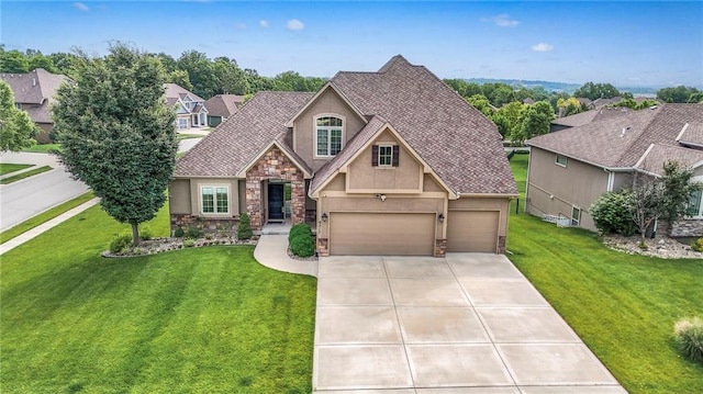 4517 N Sienna Rdg, Riverside, MO 64150 - view of front facade featuring stone siding, stucco siding, driveway, and a front lawn