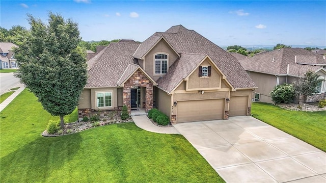 4517 N Sienna Rdg, Riverside, MO 64150 - view of front of property with stucco siding, stone siding, driveway, a front lawn, and a garage