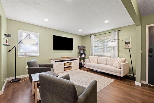 22420 W 73rd Ter, Shawnee, KS 66227 - living area with dark wood-style floors, a textured ceiling, and recessed lighting