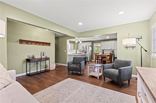 22420 W 73rd Ter, Shawnee, KS 66227 - living room featuring dark wood finished floors and recessed lighting