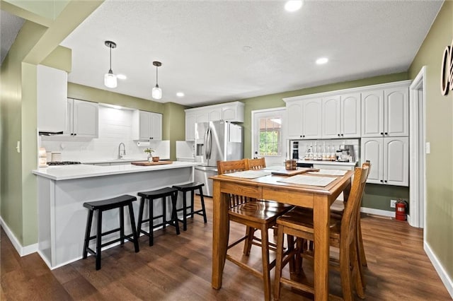22420 W 73rd Ter, Shawnee, KS 66227 - dining area with recessed lighting, a textured ceiling, and dark wood finished floors