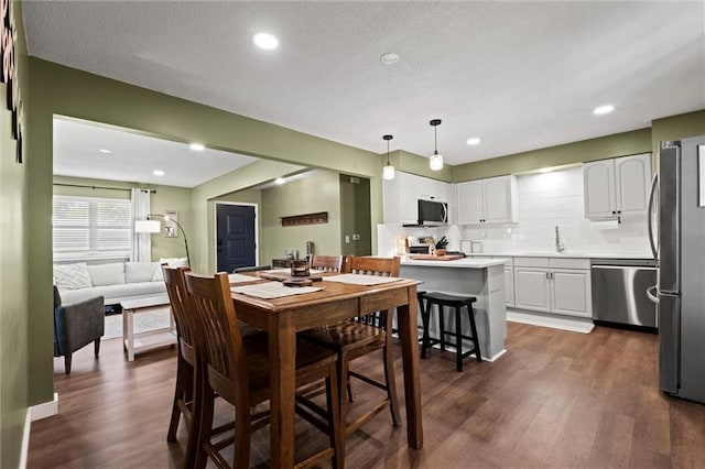 22420 W 73rd Ter, Shawnee, KS 66227 - dining area with dark wood-type flooring and recessed lighting