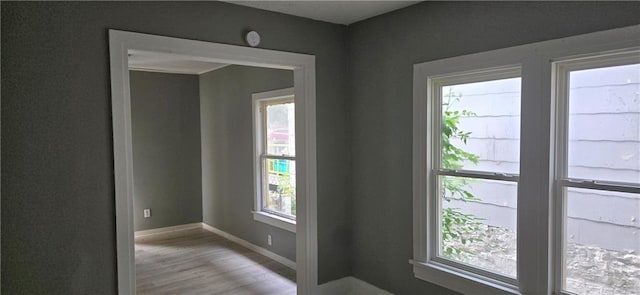 2524 Askew Ave, Kansas City, MO 64127 - spare room with wood finished floors and baseboards