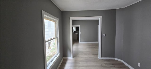 2524 Askew Ave, Kansas City, MO 64127 - corridor featuring baseboards and wood finished floors