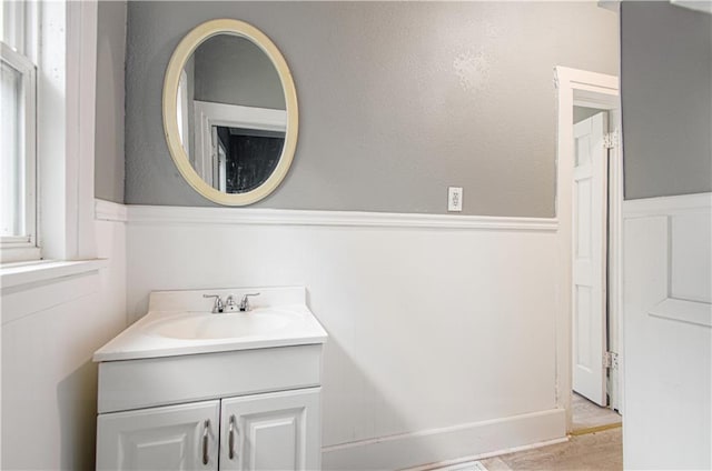 2524 Askew Ave, Kansas City, MO 64127 - bathroom featuring vanity and wood finished floors