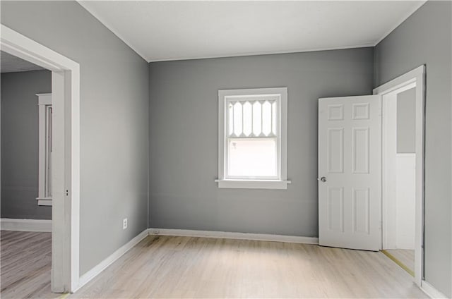 2524 Askew Ave, Kansas City, MO 64127 - unfurnished bedroom featuring light wood finished floors