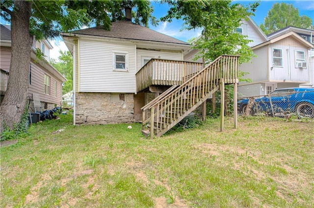 2524 Askew Ave, Kansas City, MO 64127 - back of property featuring stairway, a deck, a chimney, and cooling unit