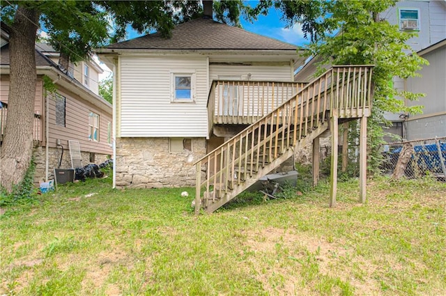 2524 Askew Ave, Kansas City, MO 64127 - back of property featuring stairs and a deck