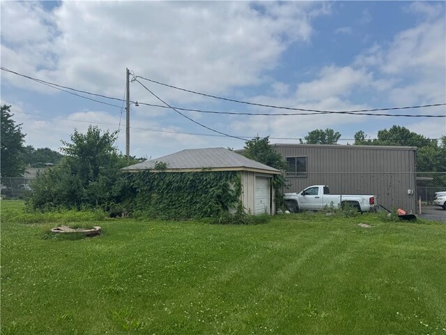 115 S Julia St, Olathe, KS 66061 - view of yard with a garage