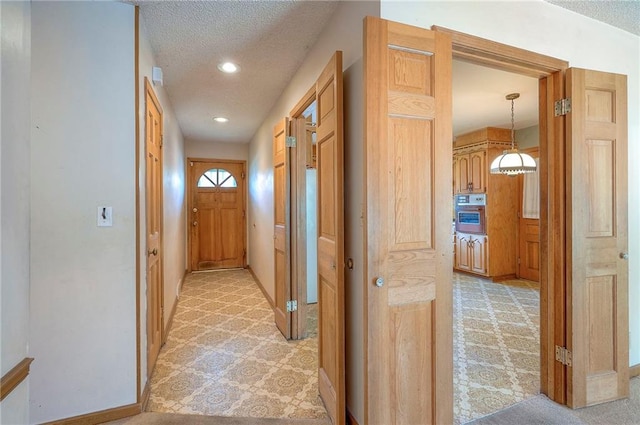 1933 N 83rd Ter, Kansas City, KS 66112 - corridor featuring light carpet, a textured ceiling, and recessed lighting