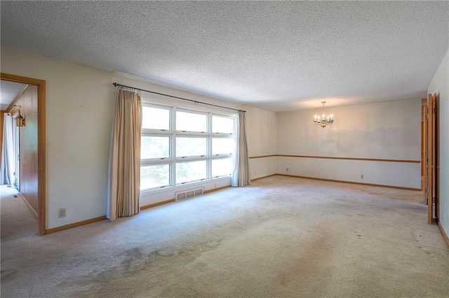 1933 N 83rd Ter, Kansas City, KS 66112 - carpeted empty room featuring a chandelier and a textured ceiling