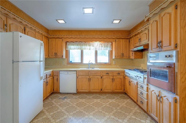 1933 N 83rd Ter, Kansas City, KS 66112 - kitchen with white appliances, under cabinet range hood, light flooring, and light countertops