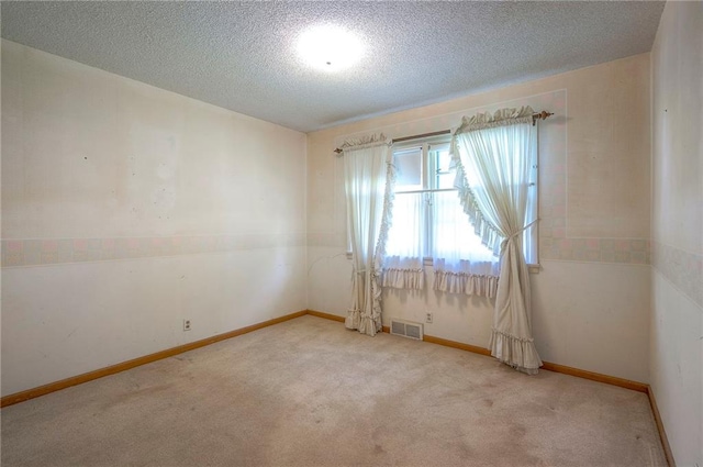 1933 N 83rd Ter, Kansas City, KS 66112 - unfurnished room with carpet floors and a textured ceiling
