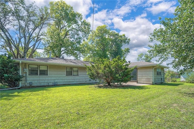 1933 N 83rd Ter, Kansas City, KS 66112 - back of house featuring a yard