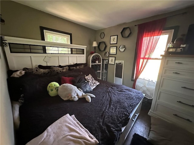 1212 S Harris Ave, Independence, MO 64052 - bedroom featuring multiple windows and wood finished floors