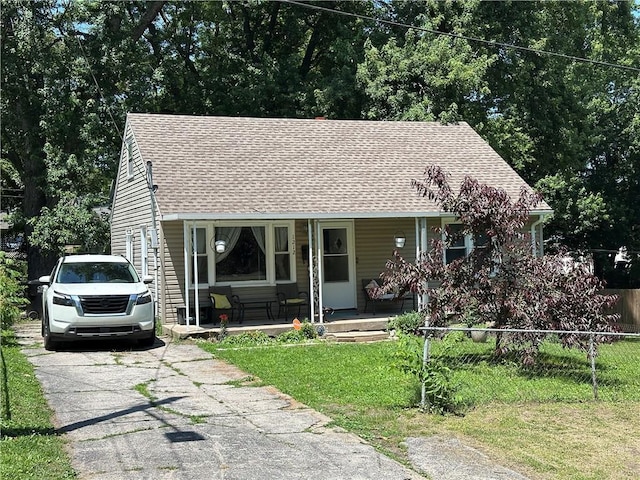 1212 S Harris Ave, Independence, MO 64052 - view of front of house with a porch and roof with shingles