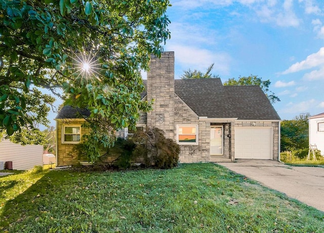 4428 N Monroe Ave, Kansas City, MO 64117 - view of front of property with an attached garage, concrete driveway, stone siding, a front yard, and a chimney