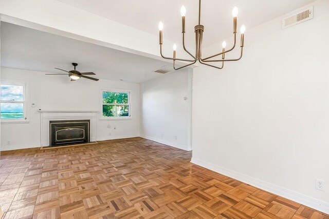 4428 N Monroe Ave, Kansas City, MO 64117 - unfurnished living room with a chandelier, a fireplace, and a ceiling fan