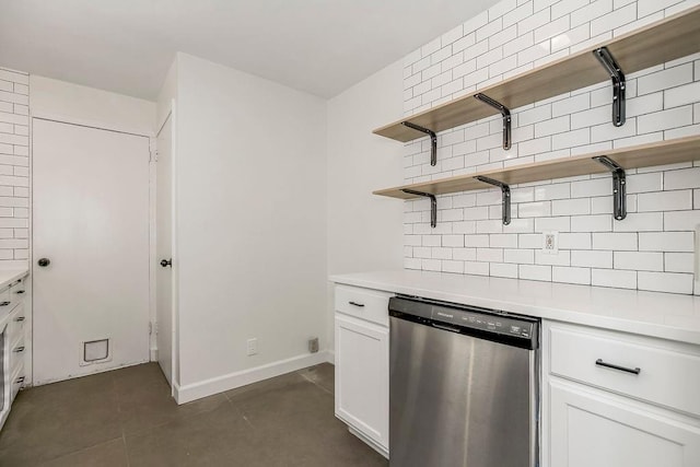 4428 N Monroe Ave, Kansas City, MO 64117 - kitchen featuring stainless steel dishwasher, open shelves, backsplash, and light countertops