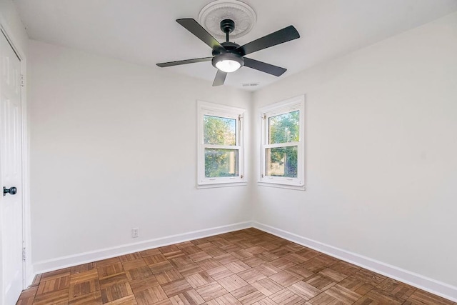 4428 N Monroe Ave, Kansas City, MO 64117 - empty room with baseboards and a ceiling fan
