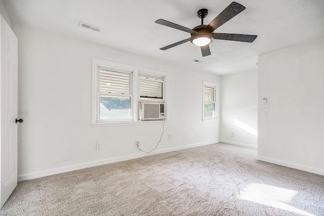 4428 N Monroe Ave, Kansas City, MO 64117 - unfurnished room featuring a ceiling fan, cooling unit, and carpet