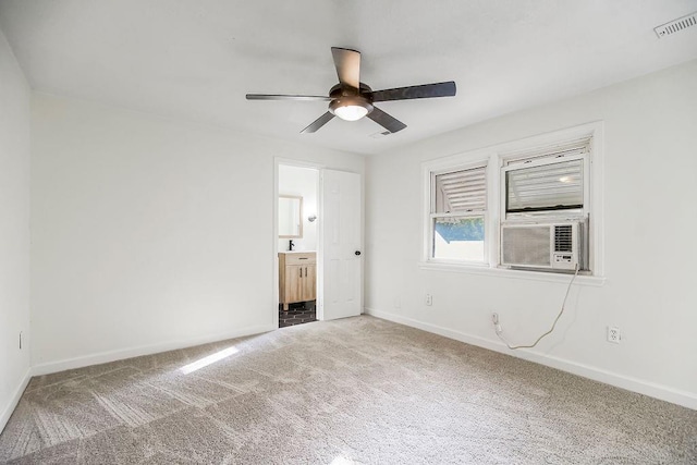 4428 N Monroe Ave, Kansas City, MO 64117 - unfurnished bedroom featuring carpet, ensuite bath, cooling unit, and ceiling fan