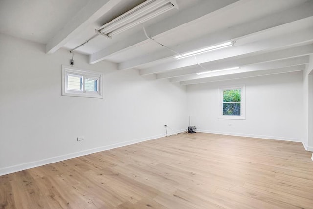 4428 N Monroe Ave, Kansas City, MO 64117 - basement featuring baseboards and light wood-style flooring