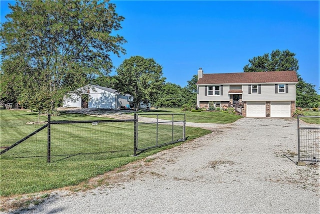 21318 S Briar Rd, Peculiar, MO 64078 - bi-level home with a chimney, an attached garage, and gravel driveway