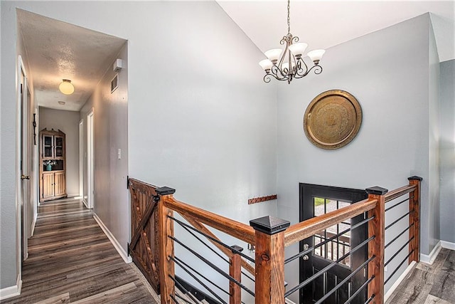 21318 S Briar Rd, Peculiar, MO 64078 - corridor with an upstairs landing, a chandelier, and wood finished floors