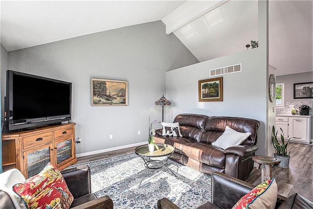 21318 S Briar Rd, Peculiar, MO 64078 - living area featuring wood finished floors, high vaulted ceiling, and beam ceiling