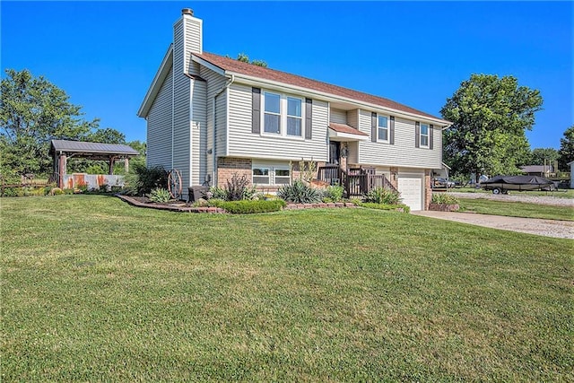 21318 S Briar Rd, Peculiar, MO 64078 - bi-level home featuring a chimney, concrete driveway, a garage, brick siding, and a front yard