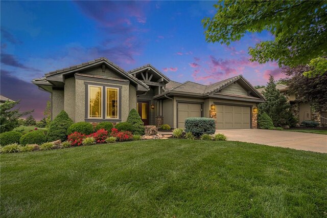 26793 W 100th Pl, Olathe, KS 66061 - single story home with concrete driveway, a garage, a front lawn, and a tiled roof