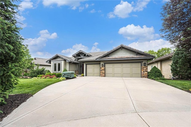 26793 W 100th Pl, Olathe, KS 66061 - single story home featuring a garage, driveway, a front lawn, and stone siding