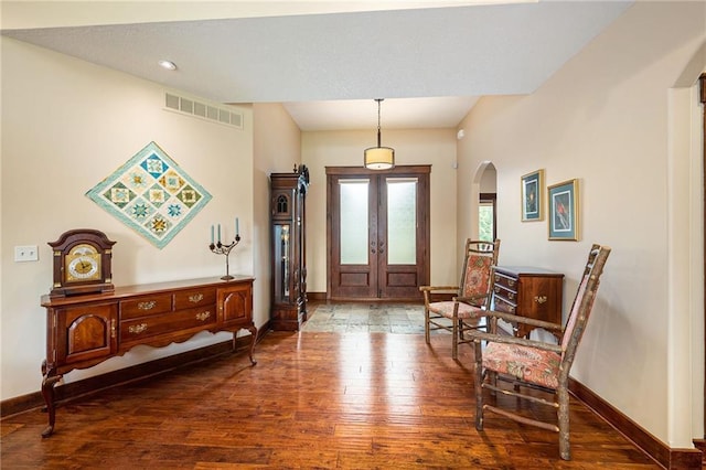 26793 W 100th Pl, Olathe, KS 66061 - entrance foyer with arched walkways, wood-type flooring, and french doors