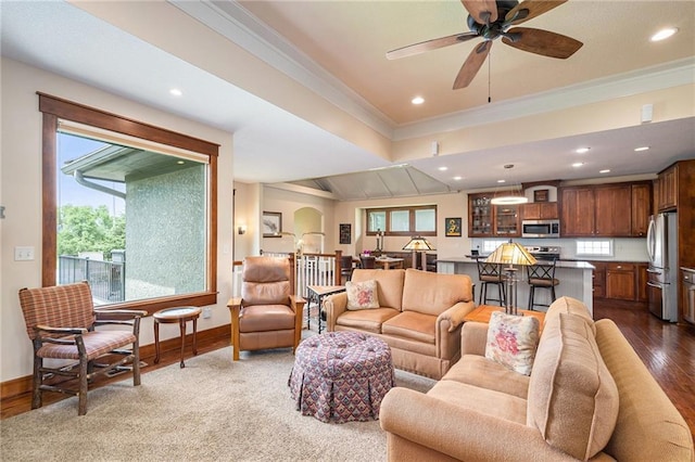 26793 W 100th Pl, Olathe, KS 66061 - living room featuring ornamental molding, healthy amount of natural light, wood finished floors, ceiling fan, and recessed lighting
