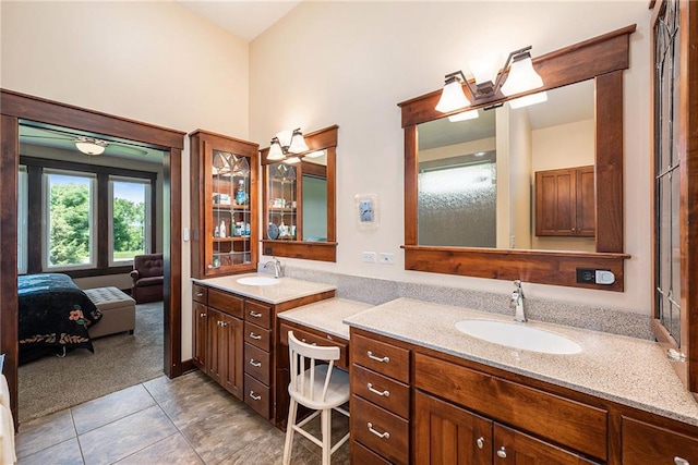 26793 W 100th Pl, Olathe, KS 66061 - ensuite bathroom with double vanity, tile patterned flooring, and a towering ceiling