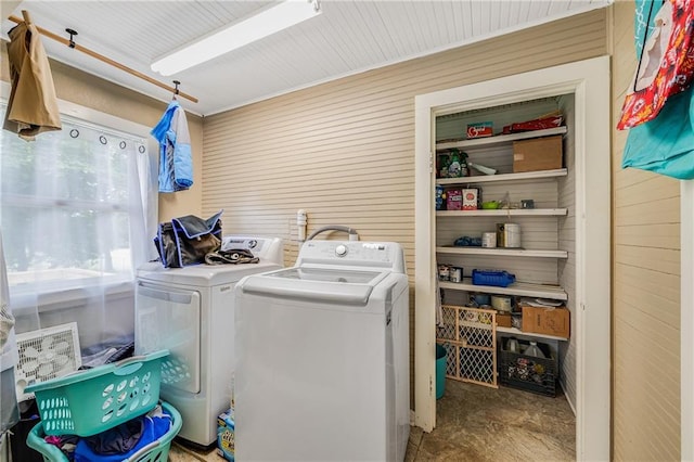 1002 S Olive St, Holden, MO 64040 - washroom featuring washing machine and clothes dryer and wood walls