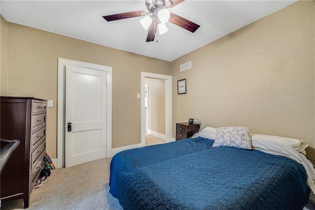 1002 S Olive St, Holden, MO 64040 - bedroom with light carpet and a ceiling fan