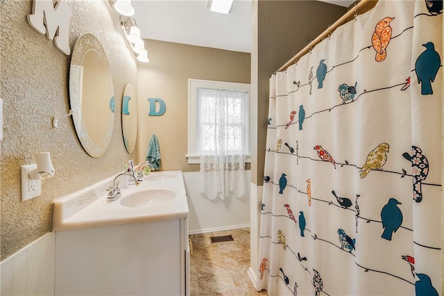 1002 S Olive St, Holden, MO 64040 - full bathroom featuring double vanity and curtained shower