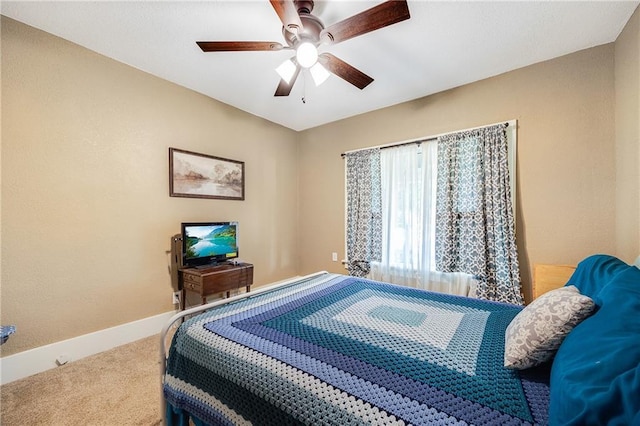 1002 S Olive St, Holden, MO 64040 - carpeted bedroom with baseboards and a ceiling fan
