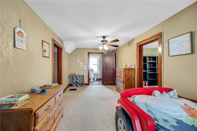 1002 S Olive St, Holden, MO 64040 - bedroom with light colored carpet, a textured wall, and a ceiling fan