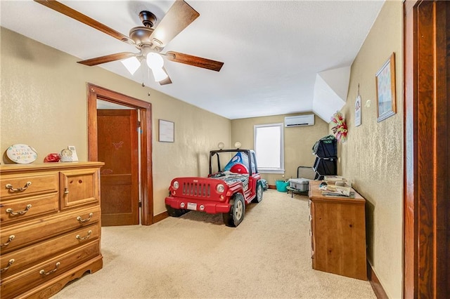 1002 S Olive St, Holden, MO 64040 - bedroom with a wall mounted AC, carpet floors, a textured wall, and a ceiling fan