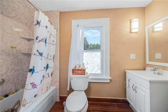 1002 S Olive St, Holden, MO 64040 - full bathroom featuring wood finished floors, vanity, and shower / bathtub combination with curtain